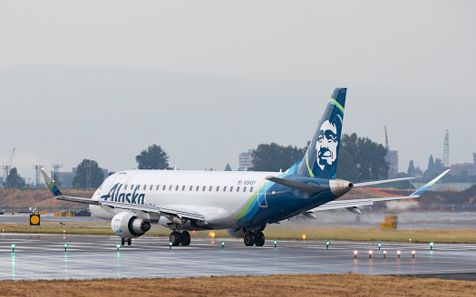Portland, Oregon, USA - August 10, 2019: An Embraer ERJ-175 taxies on to the runway prior to takeoff at Portland International Airport.