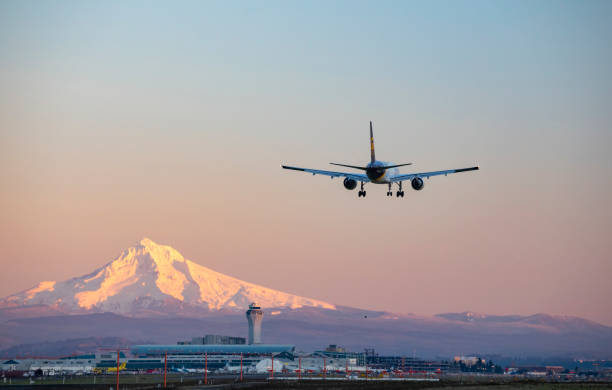 Portland, Oregon, USA - December 23, 2020: A United Parcel Service 757 landing at Portland International Airport with Mt Hood in the background.