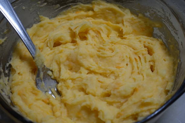 istock Mashed potatoes and sweet potatoes cooked in milk and mashed with a fork  French cooking 1293960078