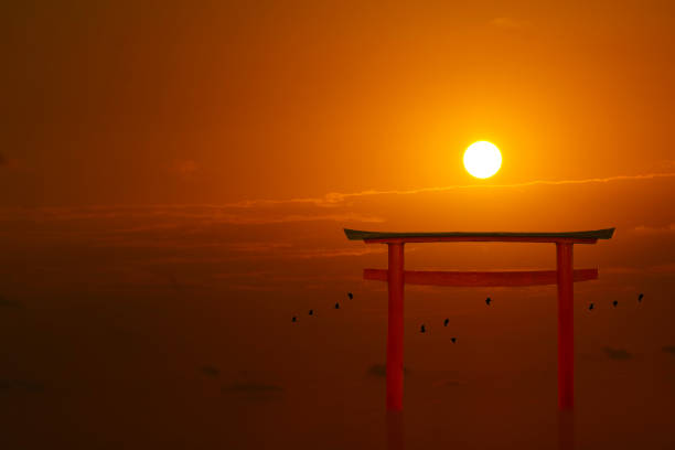 istock torii sunset orange red cloud on sky and birds flying on sea 1293963436
