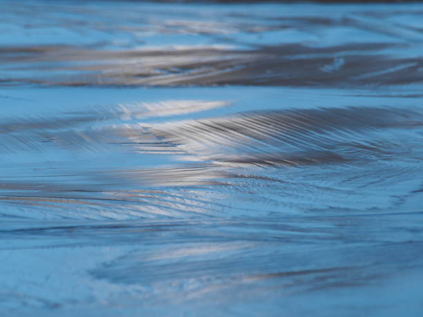 istock Sunlight on completely frozen lake surface 1293964126