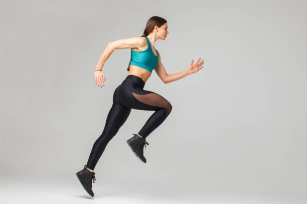istock young sportswoman running, cut out 1293965428