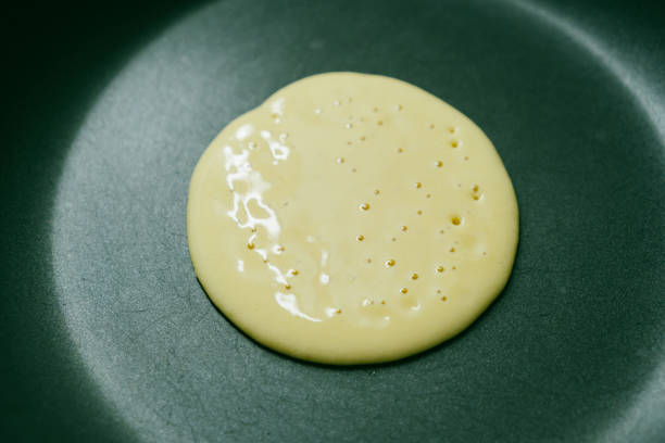 pancakes on a frying pan stock photo