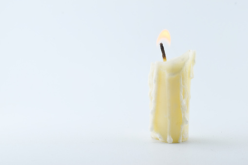 A photo of the burning candle melting can be used as a background for the theme concept of feelings