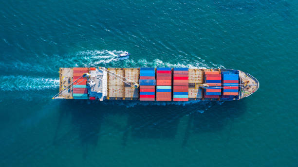 istock Aerial top view container ship with crane bridge for load container, Business global company commercial trade logistics import export, Freight shipping cargo vessel transportation. 1293977962