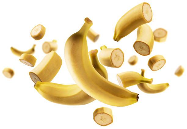 istock The levitated pieces of bananas on a white background 1293977978
