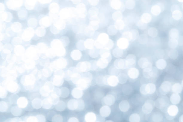 istock glitter vintage lights background. silver and white. de-focused 1293980289