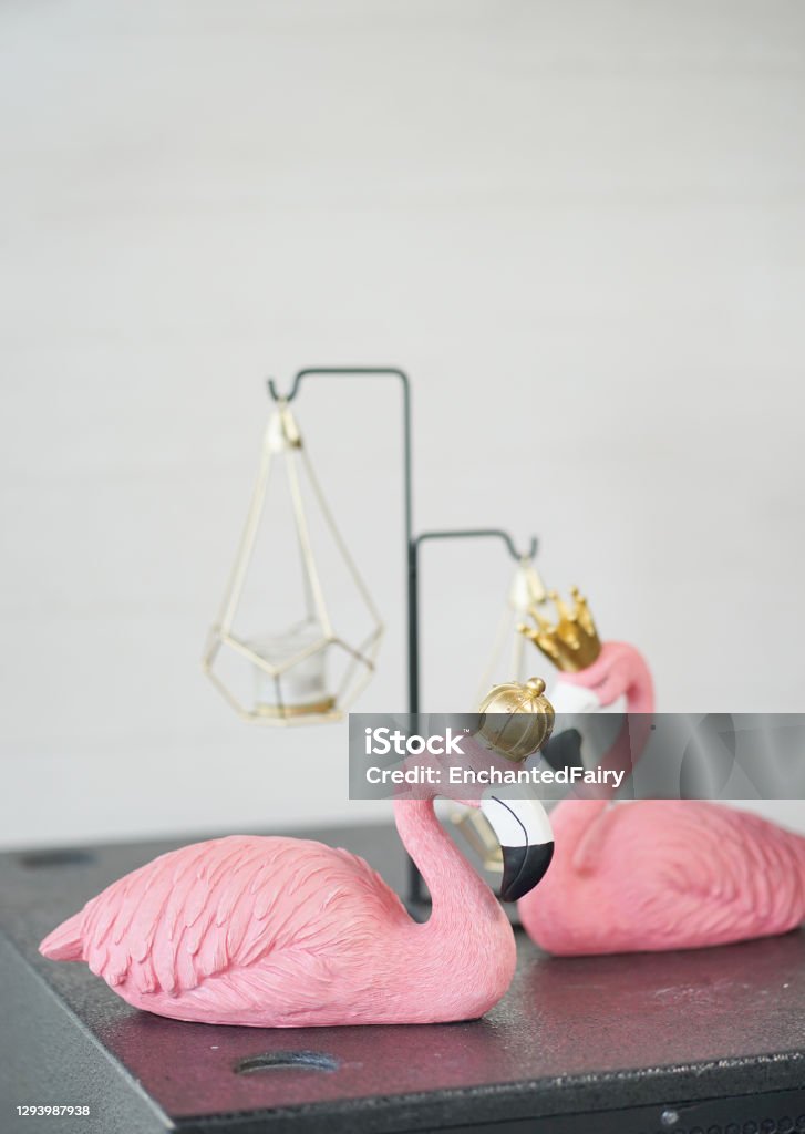 Flamingo. Interior decoration of a lover flamingo copuple with copy space on the background. Sculpture Stock Photo