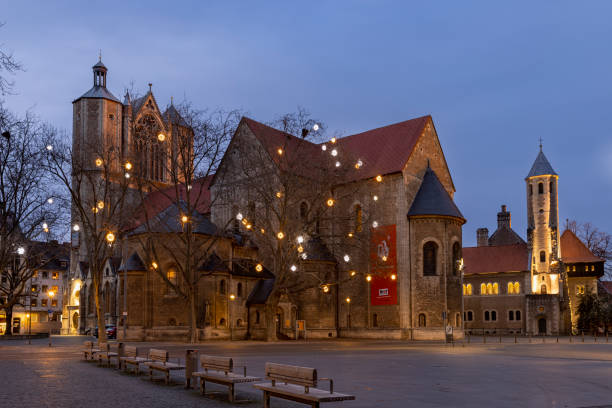 the famous Frauenkirche in Nuremberg at night with red and white roofs of christkindlesmarket stalls, Germany, Franconia, Bavaria.