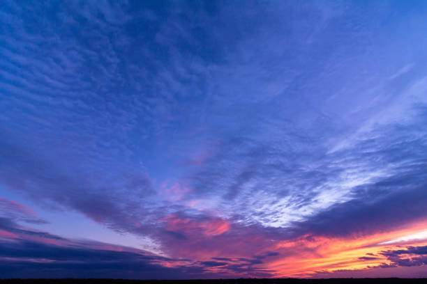 istock Colorful sunset with clouds in the evening 1293995945