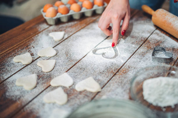 istock Making heart shape Valentine's day cookies 1293999263