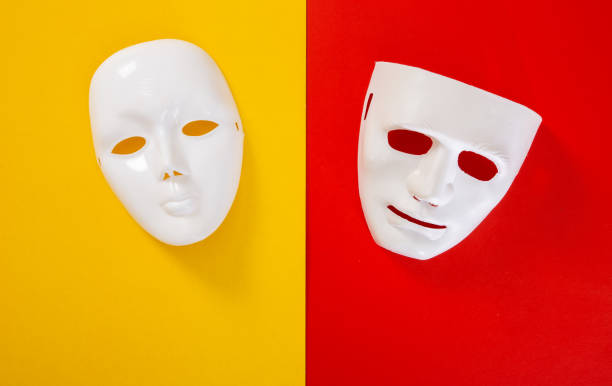 istock carnival white mask on red and yellow background 1294001936