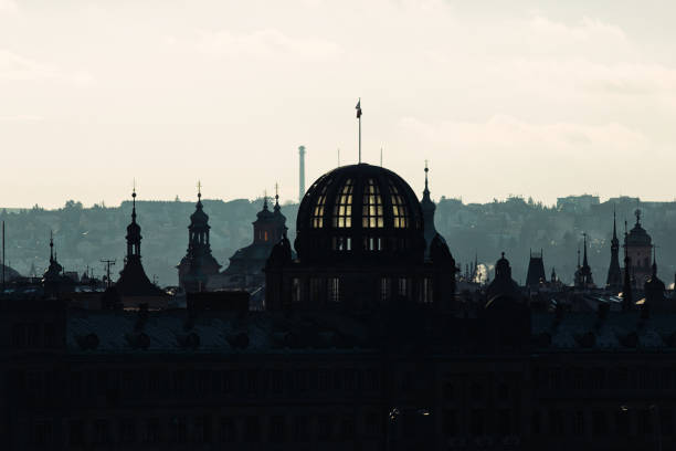 istock backlit Prague skyline buildings siwh smoke chimneys silhouette 1294005007