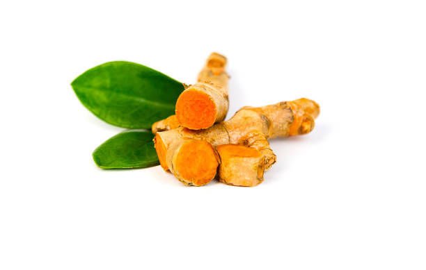 istock Fresh turmeric, cut into pieces with leaves 1294006945