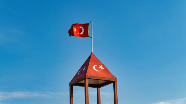 istock Turkish flag waving at blue sky. 1294006997