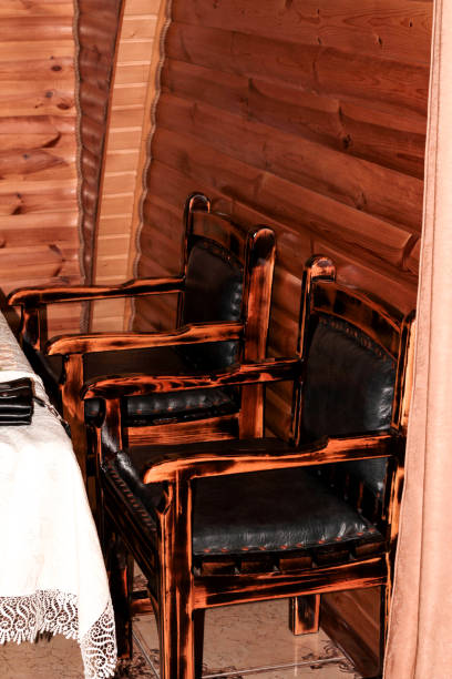 istock Wooden chairs with black seat 1294007053