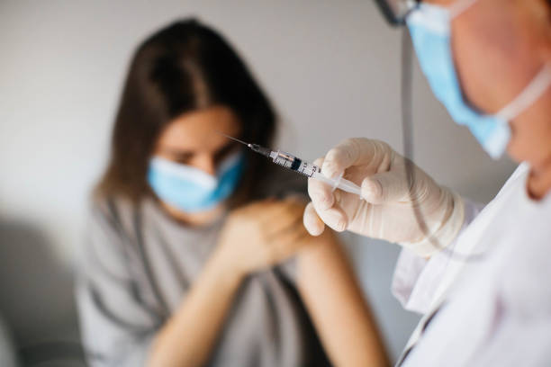 istock Young women receiving coronavirus vaccine 1294009672