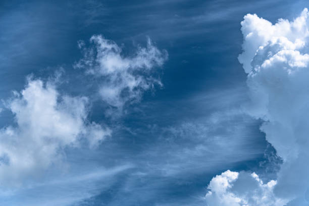 istock Picturesque clouds in blue sky on sunny day 1294009763