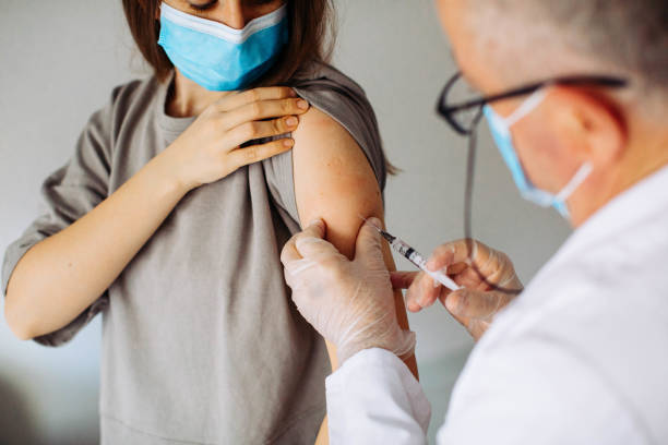 istock Young women receiving coronavirus vaccine 1294009775