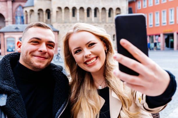 istock Young couple taking a selfie with a cellphone 1294011825