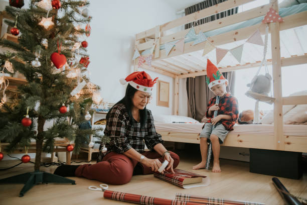 istock Senior nanny woman making Christmas present 1294013350
