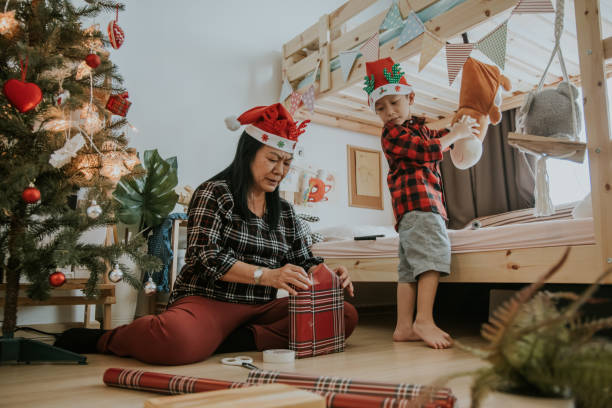 istock Cute parent enjoy making Christmas present with kid 1294013370