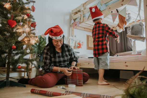 istock Senior nanny woman making Christmas present 1294013379