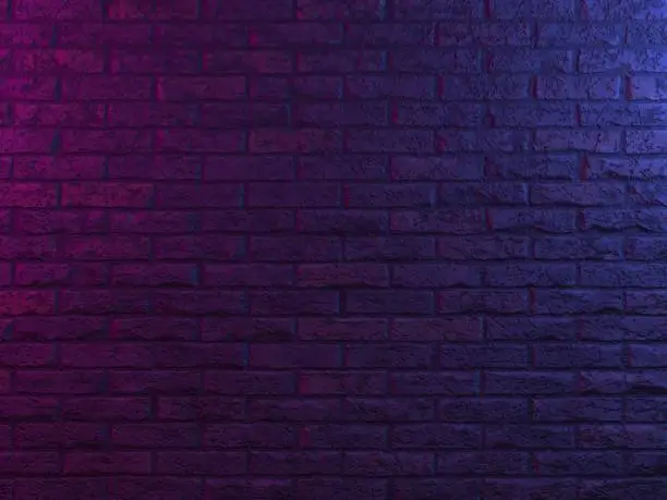Photo of Neon lights on old grunge brick wall room background