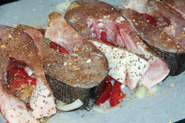 istock Silver carp fish fillet with spices and red pepper. 1294014426