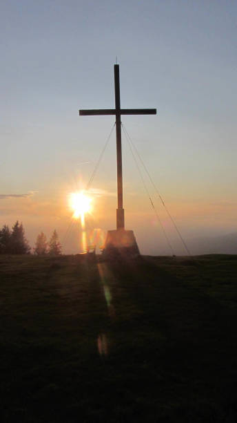 istock summit cross at the mountain top at sundown 1294014835