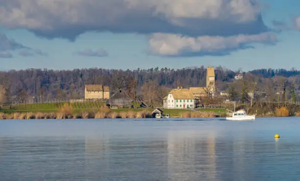 Photo of The island of Ufenau in Lake ZÃ¼rich in Switzerland between Freienbach, (Schwyz) and Rapperswil (st. Gallen). View of the St. Peter & Paul church and St. Martin's chapel