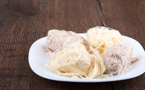 istock Cotton candy with cocoa and vanilla on a white plate. 1294018282