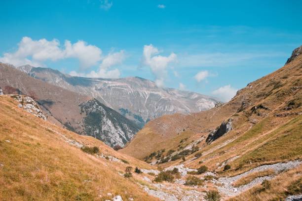 istock Panoramic view of a valley in the Sibillini mountains (Sibillini, Marche, Italy) 1294019102