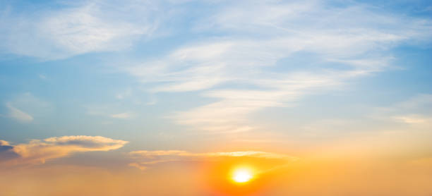 istock bright sunset over the cloudy sky, evening natural background 1294020308
