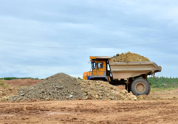 istock Mining truck and excavators working in the limestone open-pit 1294024763