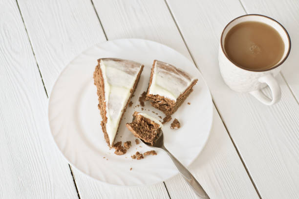 istock top view at a cup of flat white coffee and chocolate cake 1294025813