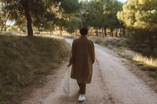 istock Rear view of a young man in a forest 1294028176
