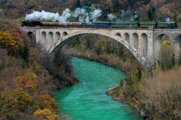 Steam Train on Solkan Bridge, Soča river, Primorska, Slovenia, Europe Solkan Bridge (Slovene: Solkanski most) is a 220-metre long stone bridge over the river Soča near Nova Gorica in western Slovenia. With an arch span of 85 metres it is the second longest stone arch in the world and the longest stone arch among train bridges. It was built in the time of the Secession, between 1900 and 1906.Nikon D850 nova gorica stock pictures, royalty-free photos & images