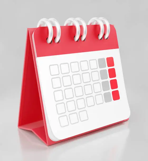 Personal on desk calendar in form of the A-frame which is placed on reflective gray surface. 3D rendering graphics.
