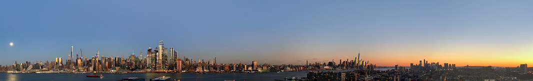 Panoramic view of Manhattan from uptown to downtown and Jersey City during dusk