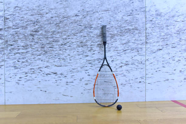 istock Squash racket and ball at court in training club 1294034087