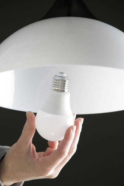istock Replacing light bulb at home. Simple DIY housework maintaince. 1294039422