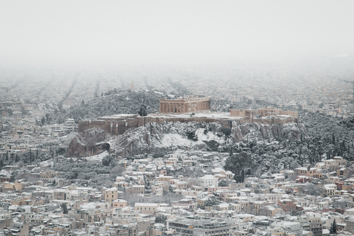 Athens early in the morning after a snow day. The Parthenon and the surrounding settlements are covered in white. A rare occurrence for the capital of Greece, best known for it’s sunlight.