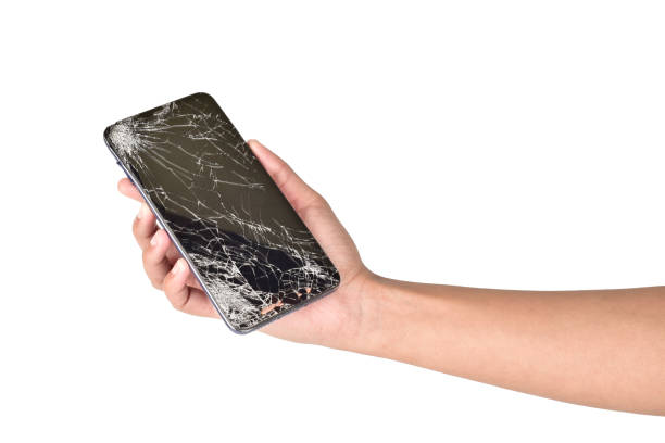 istock Cracked screen smartphone in hand isolated on white background with clipping path 1294042109