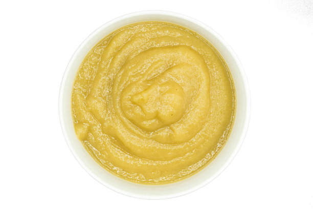 istock Applesauce in bowl top view isolated on white background 1294043494