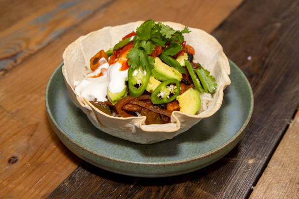 istock A delicious black bean burrito bowl on a pink  wooden kitchen work top 1294044242