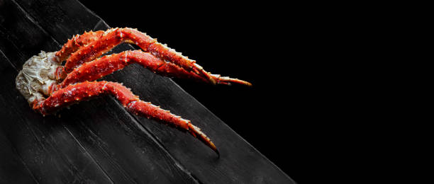 istock Fresh crab claws on vintage wooden background. Top View with Copy space. 1294046185