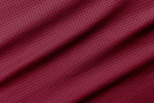 Red football, basketball, volleyball, hockey, rugby, lacrosse and handball jersey clothing fabric texture sports wear background Red football, basketball, volleyball, hockey, rugby, lacrosse and handball jersey clothing fabric texture sports wear background baseball uniform photos stock pictures, royalty-free photos & images