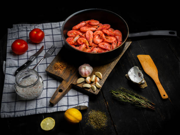 istock Raw Northern shrimps with vegetables in a frying pan 1294046873