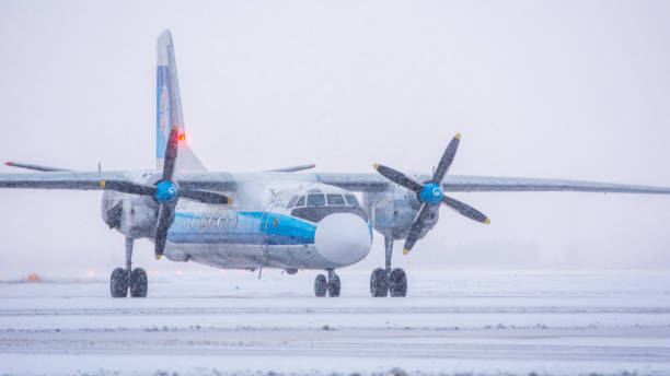 Kostroma Air Enterprise Antonov An-26B-100 Kostroma Air Enterprise Antonov An-26B-100, RA-26133, gets ready for taxiing. Pulkovo International Airport, Saint-Petersburg, Russia. 26 December 2020 antonov an 26 stock pictures, royalty-free photos & images